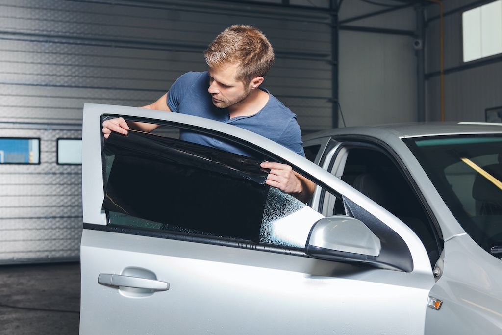 applying-tinting-foil-onto-a-car-window.jpg
