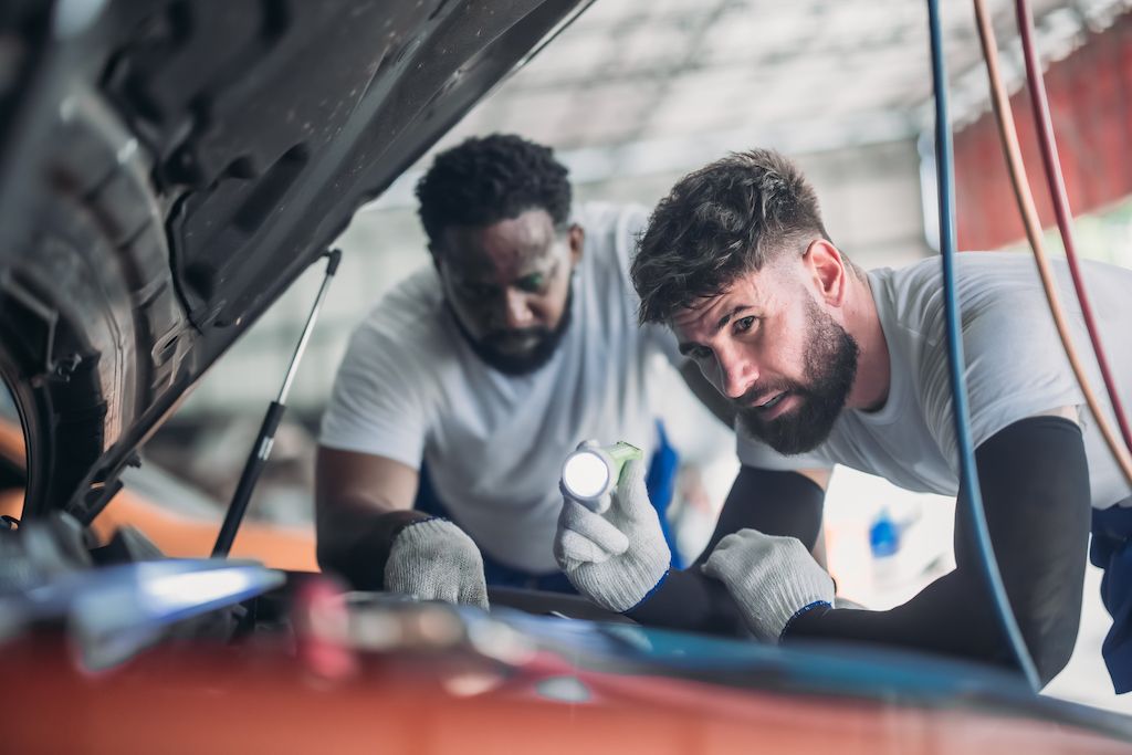 auto-mechanic-analyze-troubleshoot-address-coolant.jpg