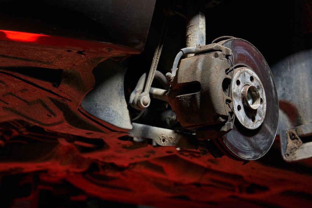 car-front-suspension-arms-brake-caliper-and-front.jpg