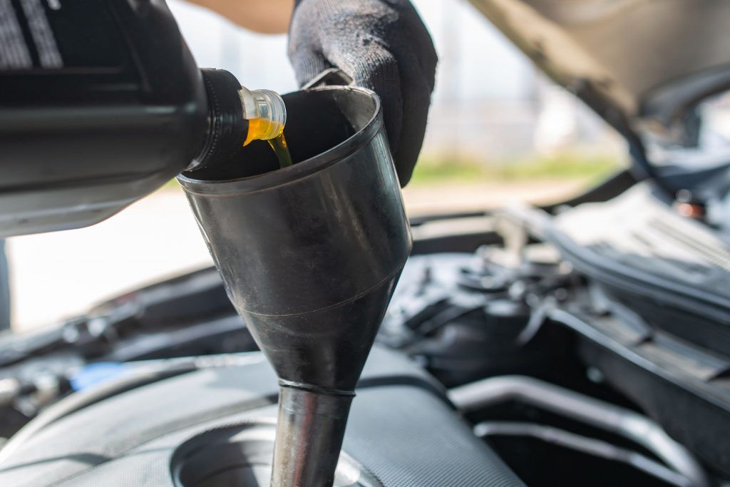 car-maintenance-service-man-changing-motor-oil-1024x683.jpg