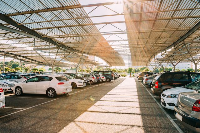 cars-on-a-covered-parking-lot-in-sunny-summer-day.jpg