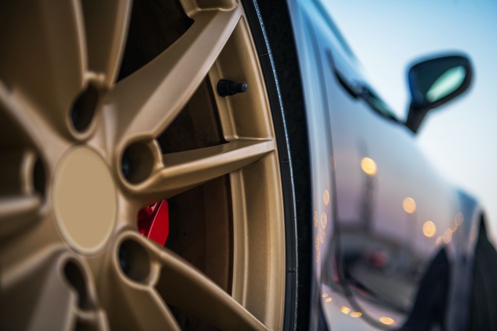 close-up-of-golden-tire-rim-of-exotic-car.jpg