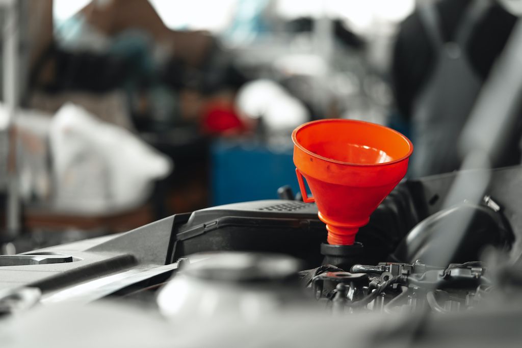 close-up-of-orange-funnel-for-oil-change-in-car.jpg