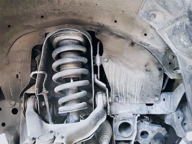 close-up-shock-absorber-and-coil-spring-of-car-suspension.jpg