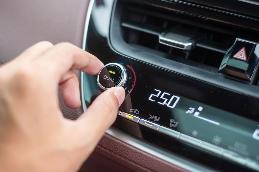 man-hand-adjusting-temperature-the-car-air-flow.jpg