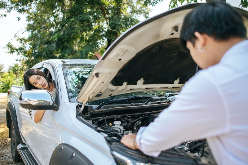 man-opens-the-hood-of-a-car-to-fix-the-car.jpg