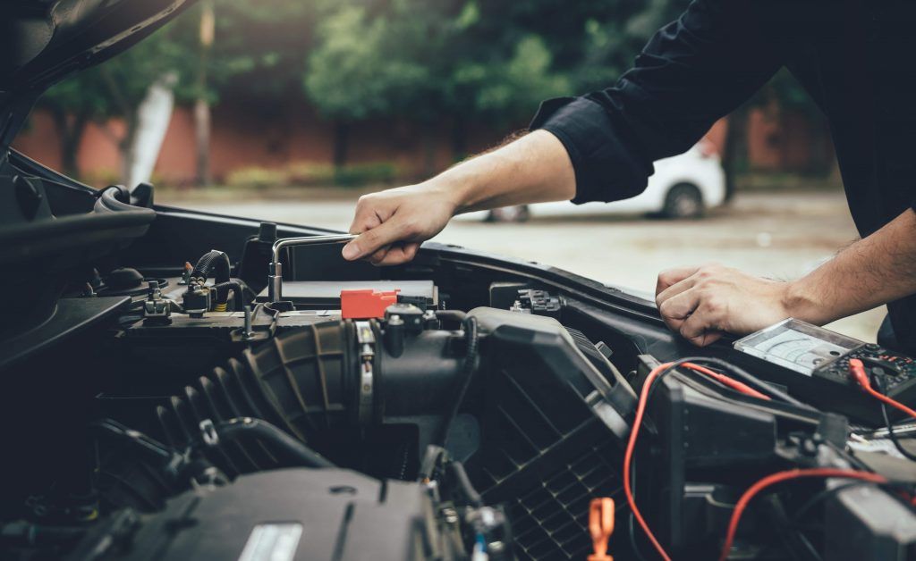 person-is-checking-the-car-engine-1024x628.jpg