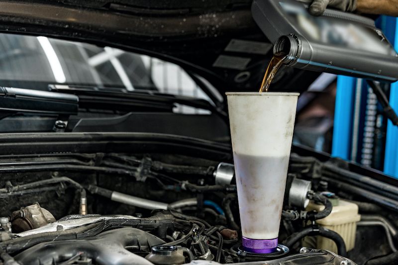 pouring-new-oil-to-the-car-engine.jpg