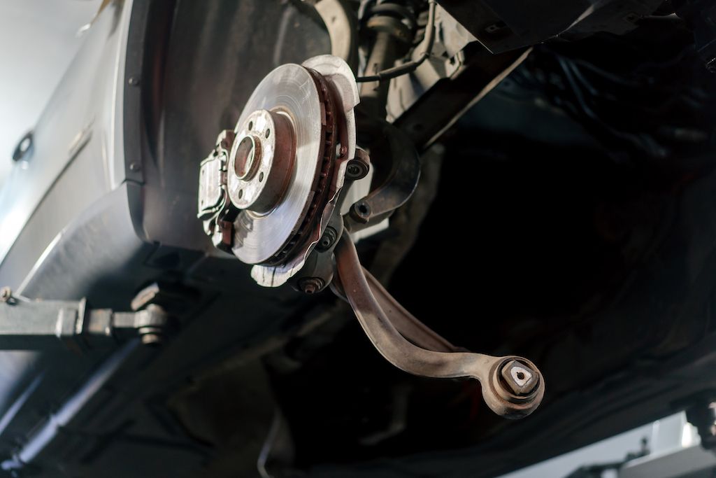 rusty-brake-pad-on-a-metal-wheel-holder.jpg