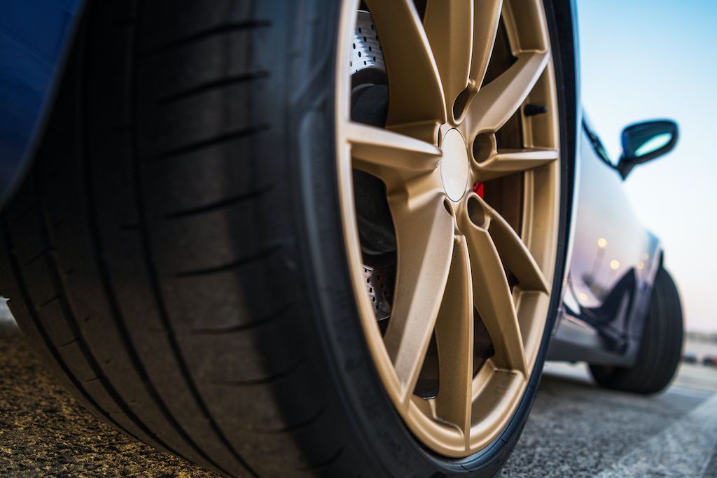 sport-looking-vehicle-golden-alloy-wheels.jpg