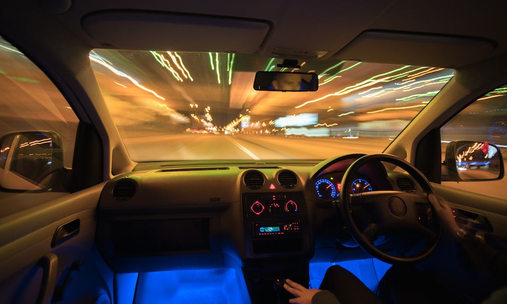 the-man-drive-a-car-in-the-city-evening-night-time.jpg